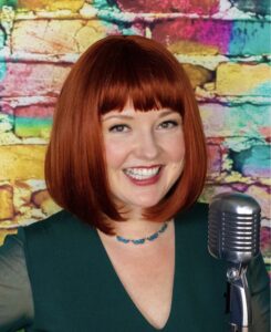 A woman with red hair and retro microphone